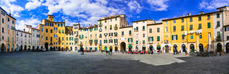 Beautiful colorful square - Piazza dell Anfiteatro in Lucca. Tuscany, Italy - obrazy, fototapety, plakaty