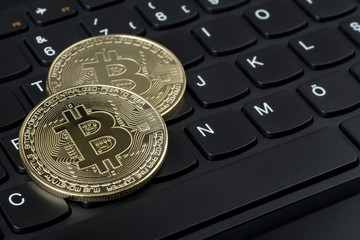 Bitcoins on computer keyboard