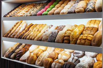 bread, buns and bakery products on the counter in the store