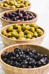 olives assorted different varieties stuffed on the table. Shallow depth of field.