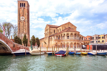 Daylight view to parked boats and historic architecture building