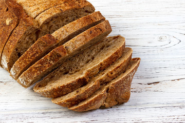 Closeup of sliced bread on a chopping board