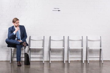 pensive caucasian businessman waiting for job interview