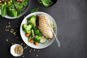 Grilled chicken breast, red rice and fresh broccoli vegetables, carrots, soybeans, spinach for...