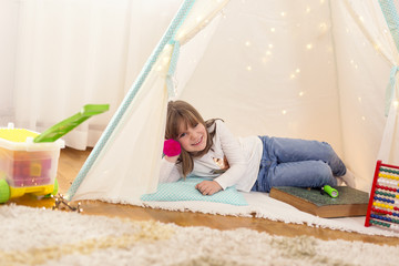 Child playing in a tent © Impact Photography