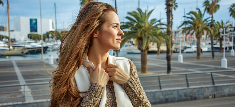 young tourist woman in Barcelona, Spain looking into distance