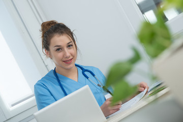 portrait of young nurse in blue uniform