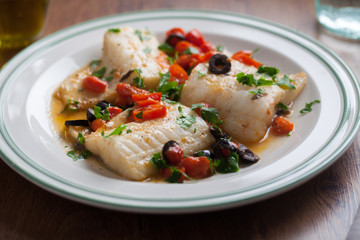 Fish fillet with cherry tomatoes and olives