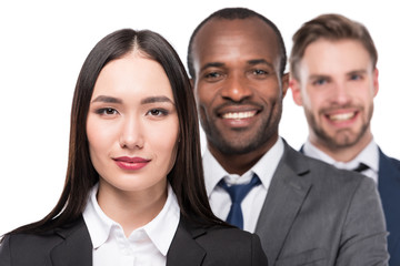 portrait of smiling multicultural young business people isolated on white