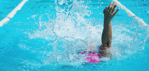 Female swimmer in an outdoor swimming pool,swimmer in blue pool water