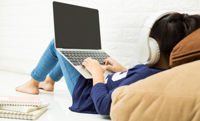 Wireless router and kids using a laptop in home. router wireless broadband home laptop computer...