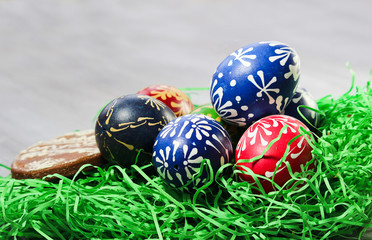 Hand made easter egg with gingerbread in green grass