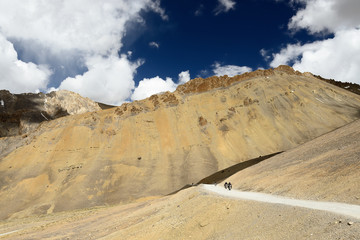 Motorcyclists on the mountain road in the Himalaya on the route between the Manali city and the Leh city located in Ladakh. This region is a purpose of motorcycle expeditions organised by Indians