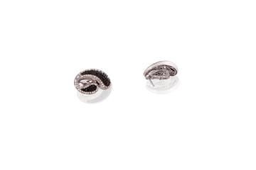 Naklejka premium Platinum precious earrings female with diamonds on white isolated background.