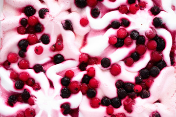 Pink ice cream with berries background. Cranberries in frozen ice-cream bowl texture. Copy space