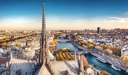 High resolution aerial panorama of Paris, France. The river Seine and autumn colors with blue sky.