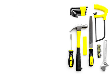 Various repair tools. Must-have for men. Equipment for building. White background top view copy space pattern