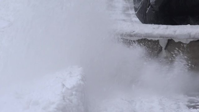 close up of snowblower mechanism clean snowy sidewak. 4K