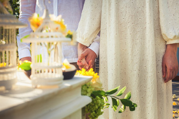 Close up newlyweds couple in marriage, wedding ceremony in Ubud.