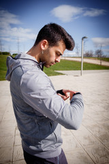 Young athletic man is preparing before running.