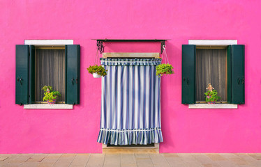 BURANO, ITALY - 2 Septenber,  2016. Pink color of walls in Burano island near Venice, Italy.