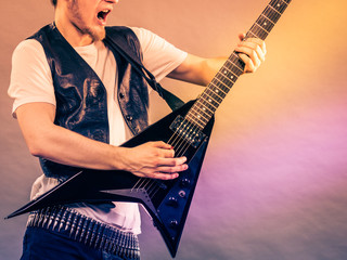 Man playing rock on electric guitar