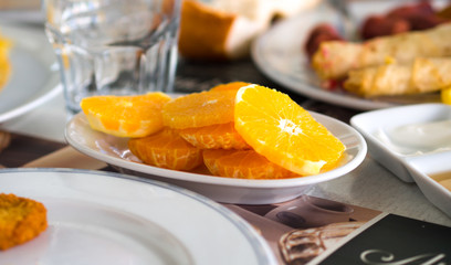 finely chopped orange slices at breakfast table