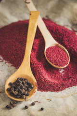 black pepper peas - spices - new crop on a wooden surface