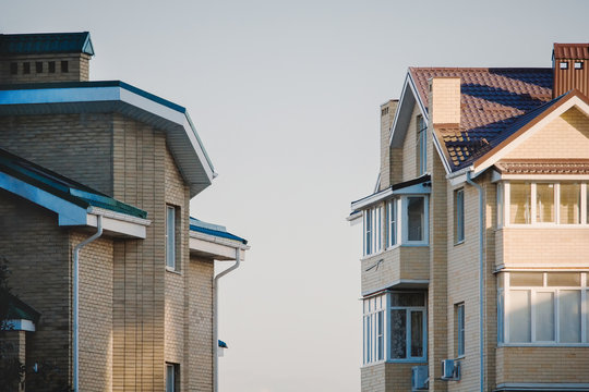 Two drick apartment buildings at sunset in Russia