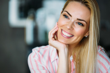 Portrait of a beautiful blonde woman smiling.