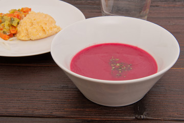 Beetroot creme soup on a table