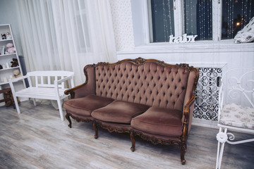 Fototapeta na wymiar Luxurious brown sofa in a modern interior.