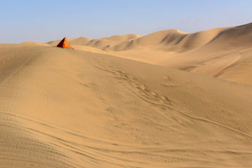 Fototapeta na wymiar Sand dunes of Ica Desert near Huacachina, Ica Region, Peru