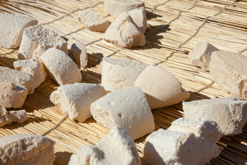 Mongolian Aaruul or Gurt hard cheese  drying on sun