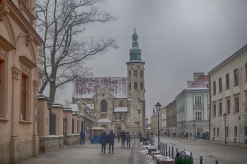 Grodzka street with St Andrew's church - obrazy, fototapety, plakaty