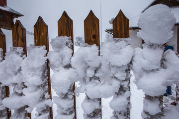 Snow-covered fence, snowstorm in the Carpathians, Ukraine