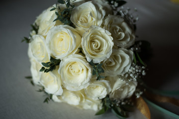 White rose flower bouquet in bundle shape for bridal in wedding ceremony