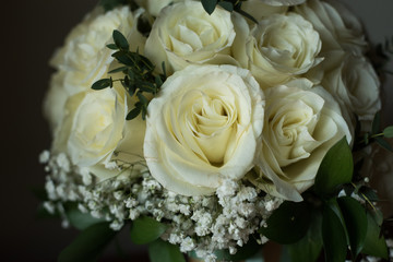 White rose flower bouquet in bundle shape for bridal in wedding ceremony