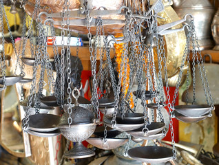 Metal cups on chains from old scales and other hand-crafted products on the market. 