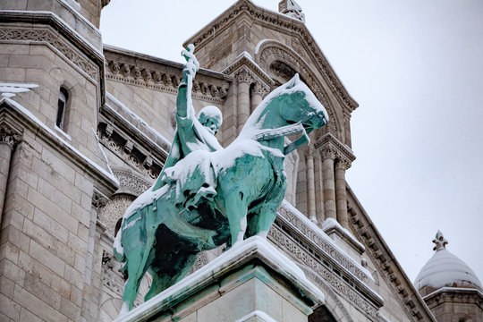Snow covered statue in Paris