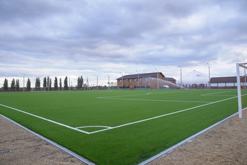 Fototapeta na wymiar Football field with artificial turf