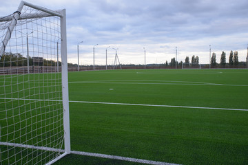 Fototapeta premium Football field with artificial turf