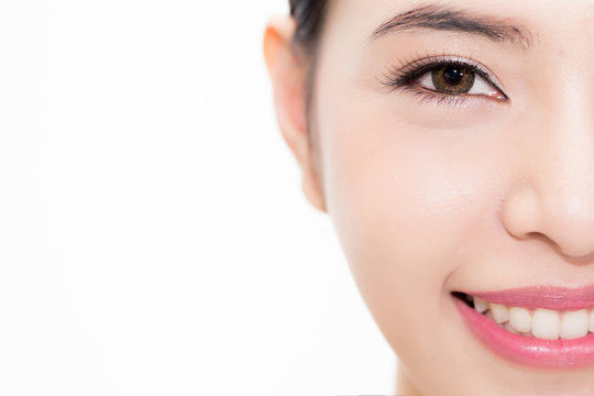 Close-up of Young beauty Asian face focused on eyes, beautiful woman isolated over white background. Healthcare and Eye care concept.