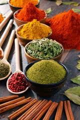 Variety of spices and herbs on kitchen table