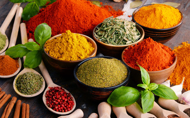 Variety of spices and herbs on kitchen table