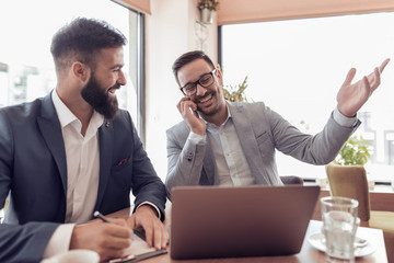 Two business people talking on meeting at office.