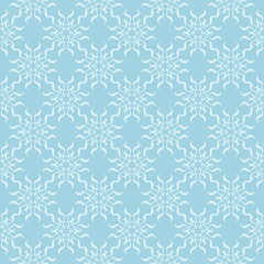 Fototapeta premium White floral ornament on blue. Seamless pattern