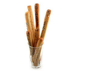 Salty sticks stock  images. Salty sticks on a white background. Salty snack in a glass. Big salty sticks