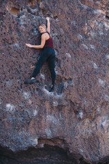Blonde Woman Enjoying Bouldering Outside