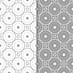 Gray and white geometric ornaments. Set of seamless patterns